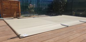 Couverture de sécurité à barres sur piscine coque polyester -10m²